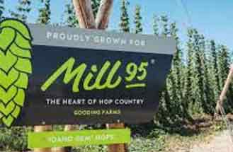 An attractive sign that reads Proudly Grown for Mill 95 - The Heart of Hop Country, Gooding Farms